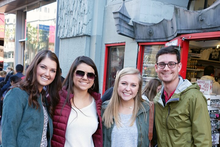 Explore the lively energy of Los Angeles with friends as you visit iconic landmarks capturing memories in front of famous attractions while enjoying guided insights from experienced local tour guides.